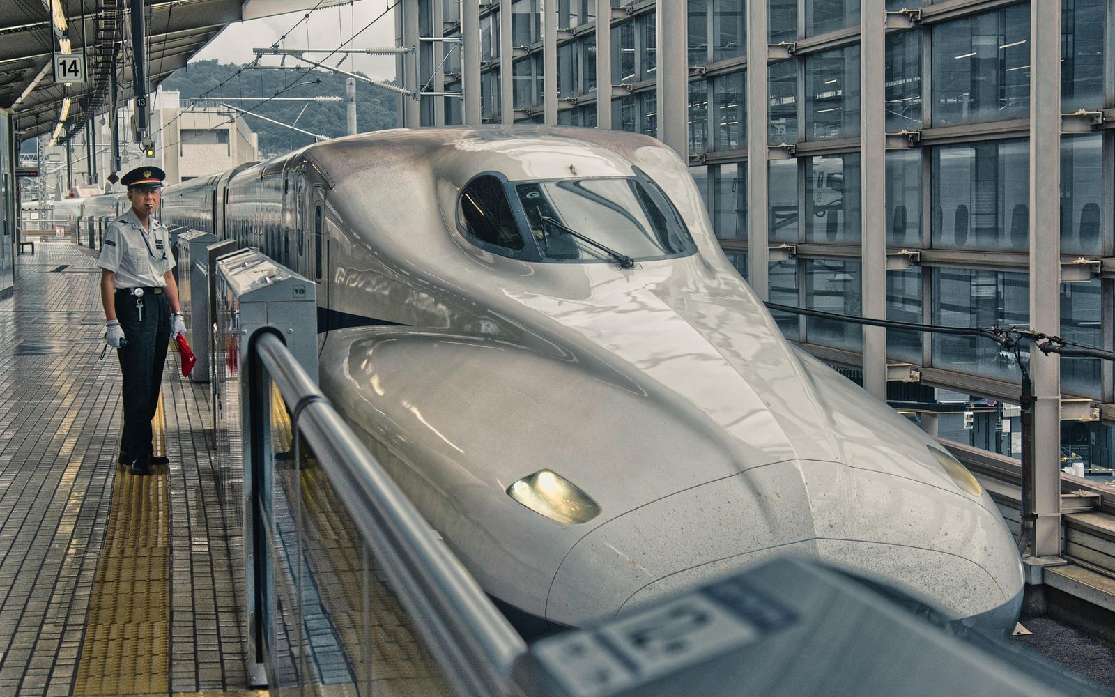 The nose of a shinkansen waiting at a station platform